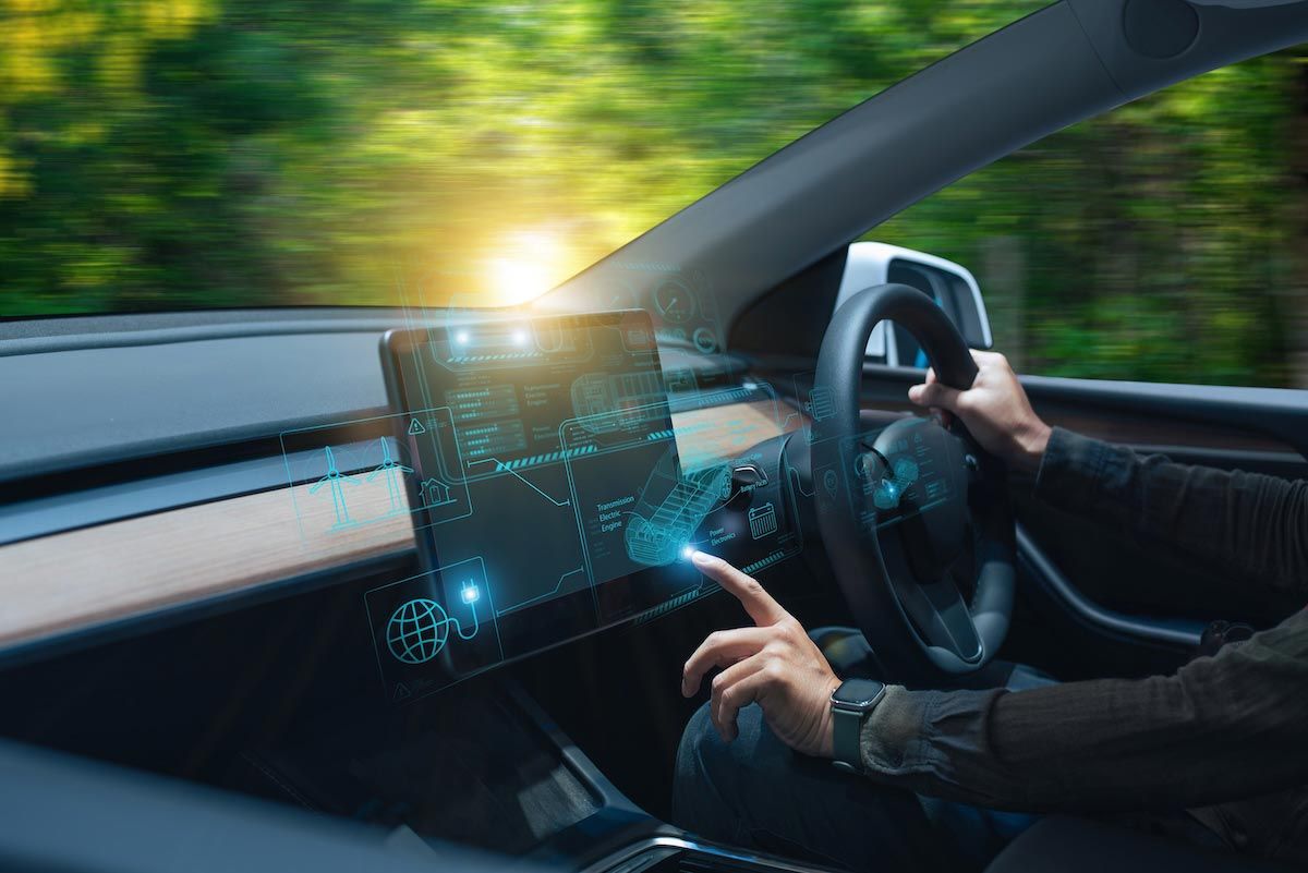 A man using AI technology in an electric vehicle
